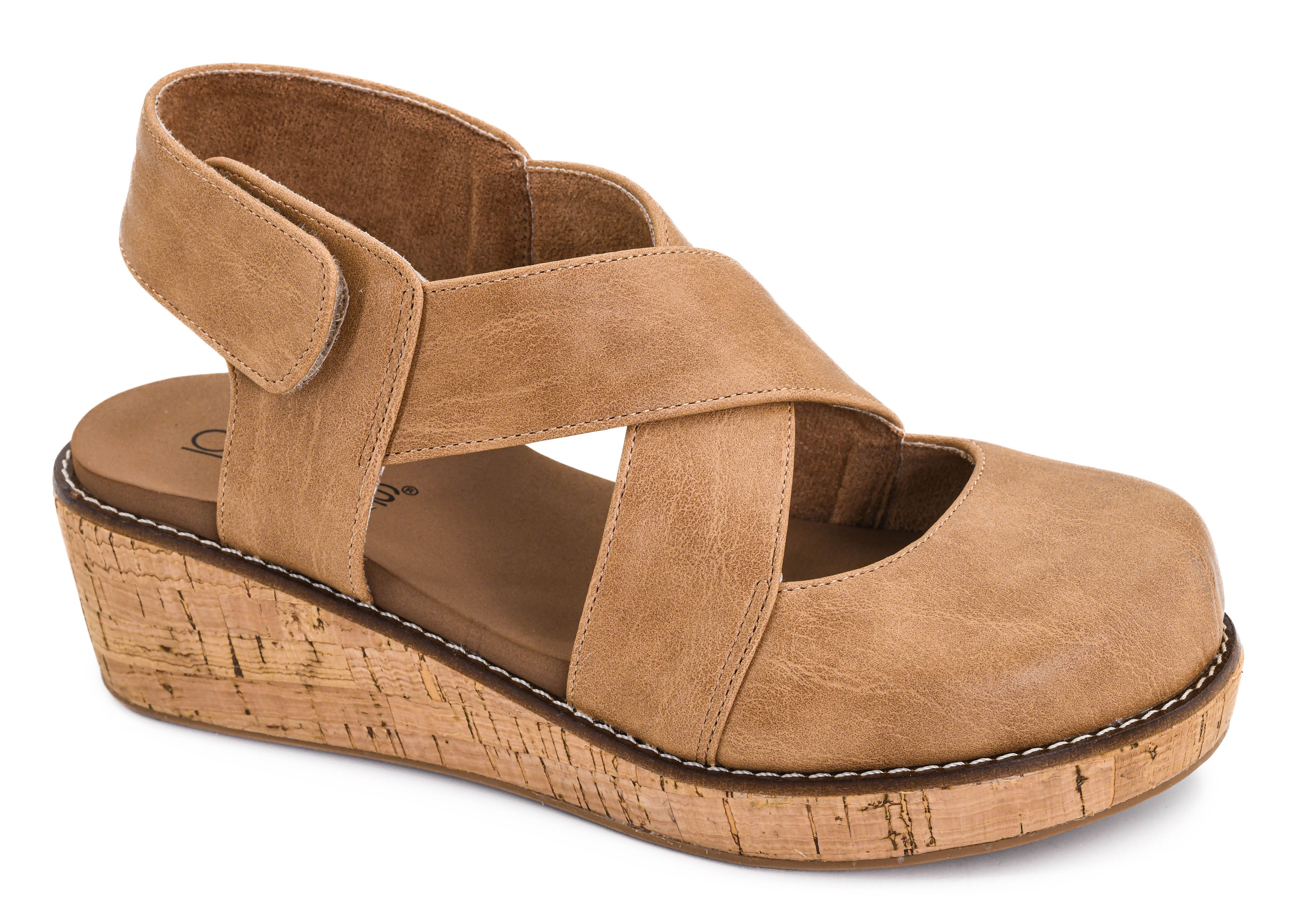 A Corky’s tan wedge sandal with crisscrossing straps and a cork-textured wedge heel,
