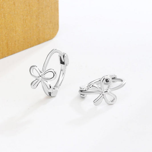 Huggie Hoops With Bow Detail in SILVER