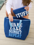     Stylish navy canvas cosmetic pouch with zip closure and oversized STUFF graphic for organizing everyday essentials.
