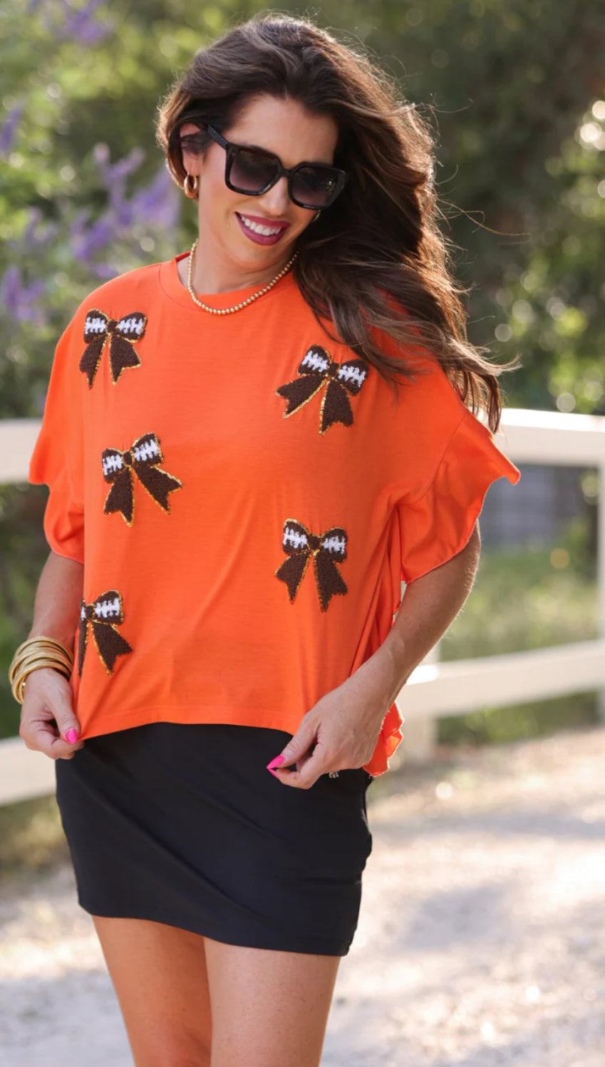 Sideline Sparkle Ruffle Top in Orange