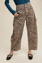 Straight-on view of zebra print barrel jeans with relaxed legs and ankle-length hems