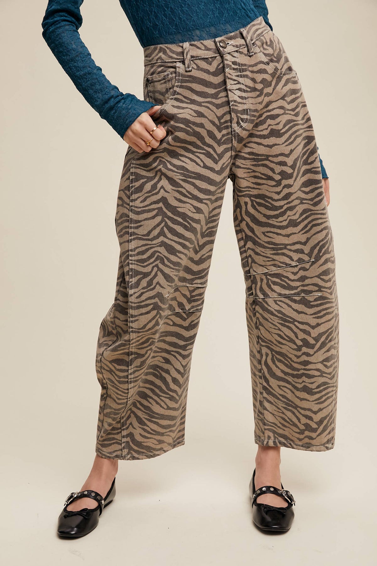 Straight-on view of zebra print barrel jeans with relaxed legs and ankle-length hems