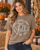 Women’s heather taupe fall graphic T-shirt with pumpkin, bonfires, sweaters, hayrides, falling leaves, crisp air and boots design