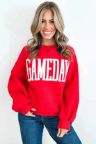 Women’s Game Day letter patch crewneck sweatshirt with oversized collegiate-style lettering and relaxed fit.
