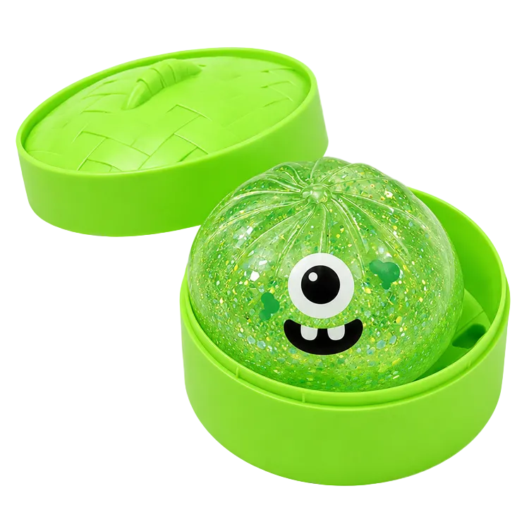 Green slime ball dumpling with a face in a green steamer container