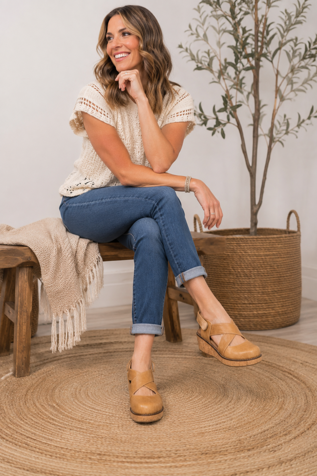 Woman wearing Corkys Bring It In camel wedge shoes with cuffed jeans in a casual fall outfit
