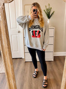 Gray Bengals reversible mock neck sweatshirt with Cincinnati Bengals graphic styled with black leggings