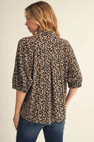 Back of leopard print blouse featuring relaxed fit, half sleeves and elastic cuffs