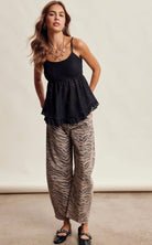 Zebra print barrel jeans paired with a floral lace peplum cami top