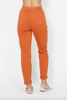 Back view of Judy Blue orange denim joggers with two back pockets and cuffed hems