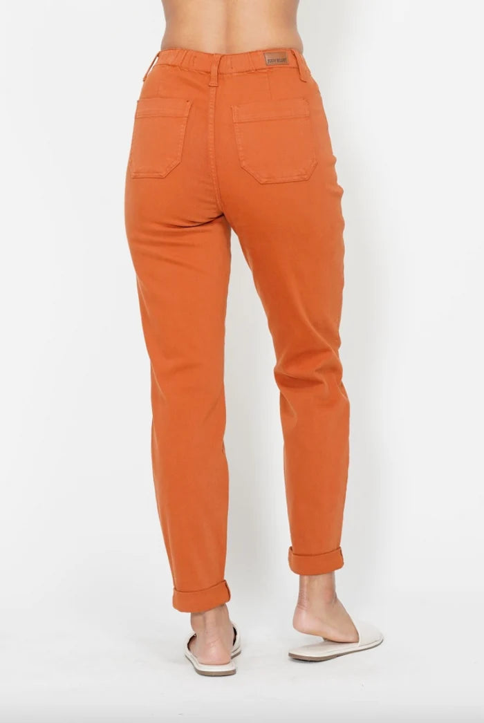Back view of Judy Blue orange denim joggers with two back pockets and cuffed hems