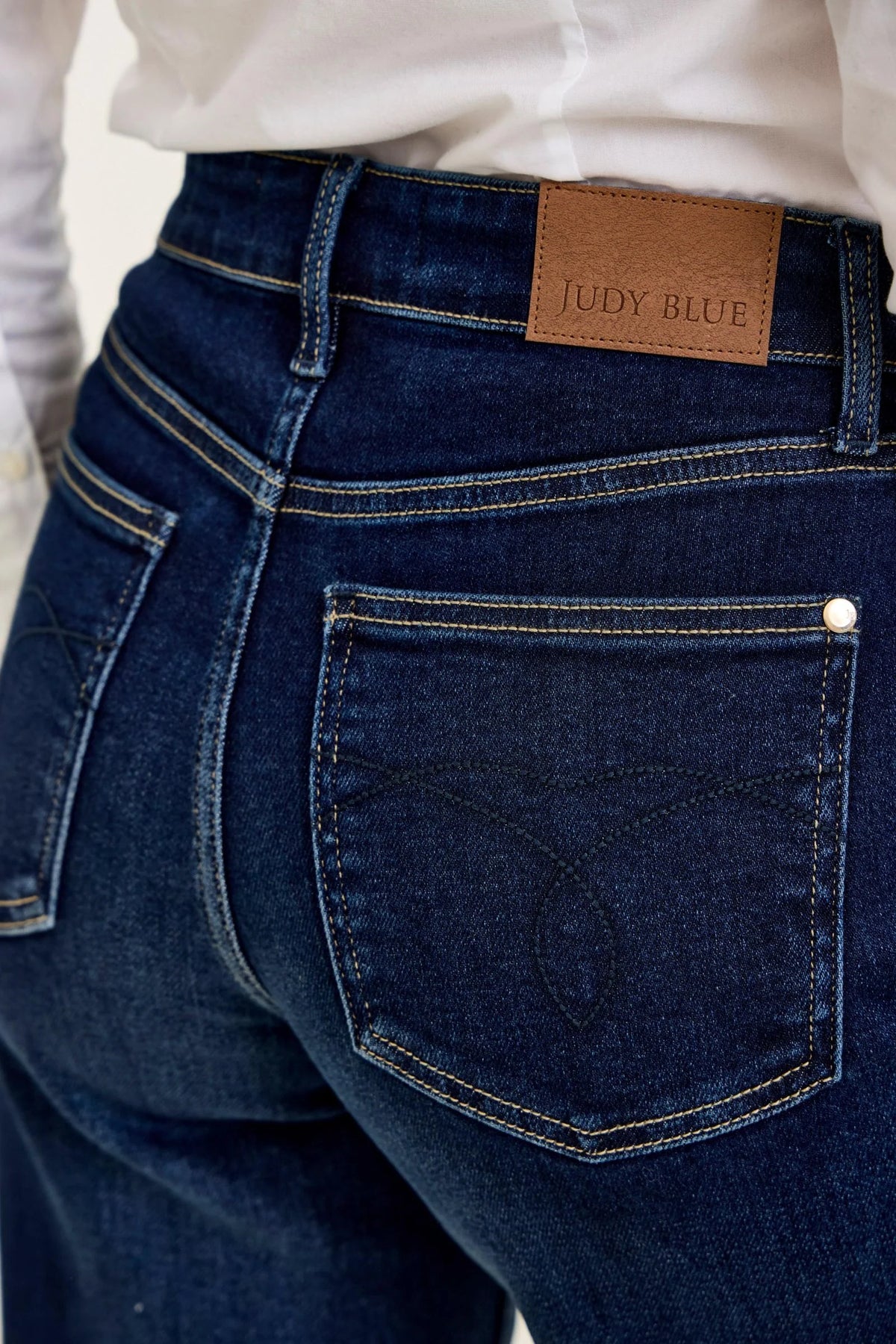 Back view of Judy Blue Twilight Blue wide leg jeans showing rear pockets and finished hems