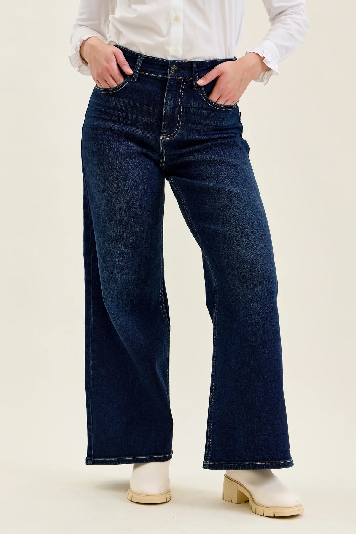 Angled front view of Judy Blue high waist wide leg jeans in dark indigo denim
