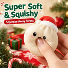 Soft Christmas dumpling stress relief squishy toy being squeezed to show its flexible texture