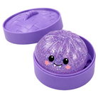 Purple vampire glittery dumpling with a smiling face in a matching purple dumpling container