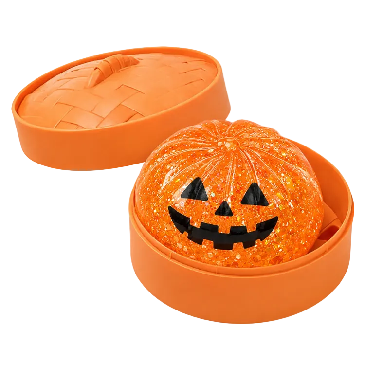 Orange Halloween-themed steamer container with a jack-o'-lantern pumpkin dumpling squishy design