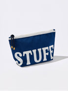 Navy canvas STUFF zip pouch with white lettering and rope zipper pull for organizing makeup, toiletries, travel essentials, and everyday accessories.