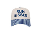 embroidered Sun Kissed baseball cap with navy and blue seersucker striped brim